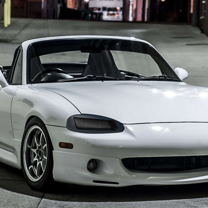 Enhance your Mazda Miata NB2 with custom aero parts like front splitters, side skirts, spoilers, and diffusers for improved aerodynamics, performance, and a sportier look