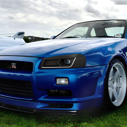 Nissan Skyline R34 high-flow performance fuel injectors, oversized capacity, E85 compatibility, optimized fuel delivery, race-ready ignition timing, track-proven power enhancement.

