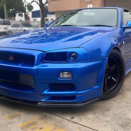 Nissan Skyline R34 high-performance carbon fiber intake system, cold air intake, short ram intake, high-flow air filter, optimized throttle response, increased turbo spool speed, track-ready induction setup.

