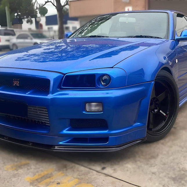 Nissan Skyline R34 high-performance carbon fiber intake system, cold air intake, short ram intake, high-flow air filter, optimized throttle response, increased turbo spool speed, track-ready induction setup.

