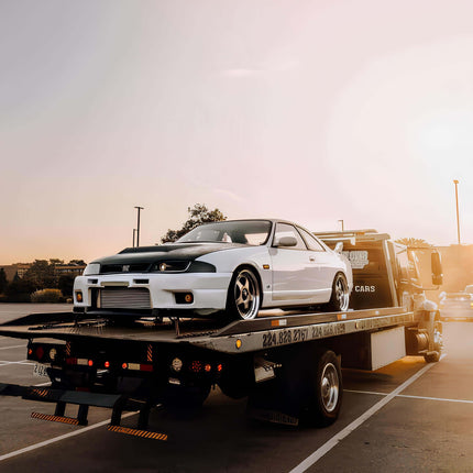 Nissan Skyline R33 GTR carbon fiber rear diffuser, track-tested aerodynamic enhancement, reduced drag, high-speed rear stability, aggressive styling, race-inspired airflow management.

