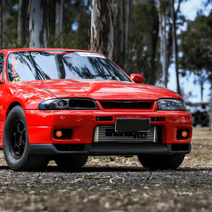 Skyline R33 GTS25 single turbo conversion, billet compressor wheel, oversized front-mount intercooler, race-proven stainless steel turbo manifold, track-optimized forced induction setup, dyno-tested power gains.

