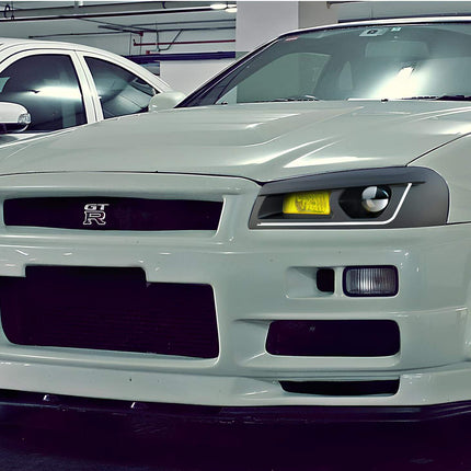 Skyline R34 upgraded performance differential, reinforced LSD, optimized torque distribution, aggressive power transfer system, high-speed cornering stability.

