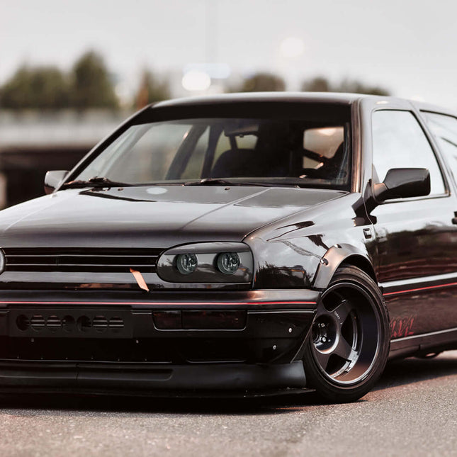 VW Golf MK3 Smoked Headlights & Clear Indicators – Get a bold look with smoked headlights and clear indicators for your Golf MK3 1995-1998. With improved illumination and a modern aesthetic, this lighting set enhances both visibility and styling.

