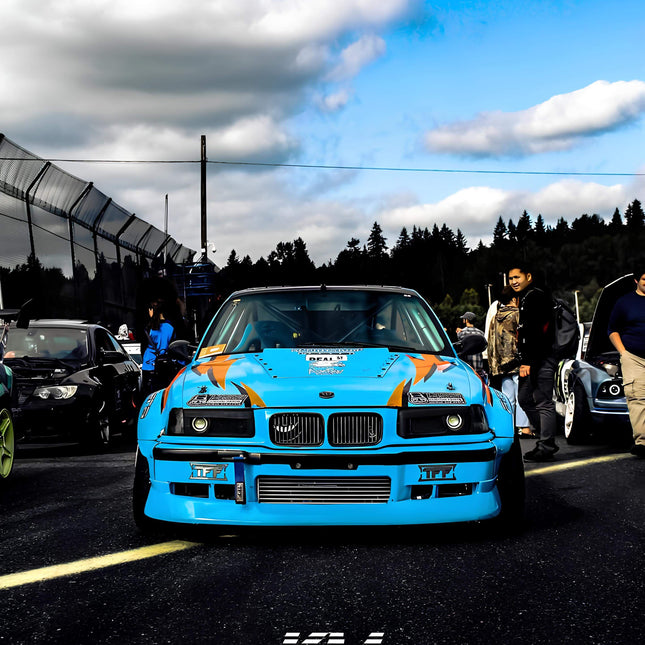 BMW E36 front bumper lip spoiler for improved aerodynamics, aggressive styling, and increased downforce. A must-have upgrade for M3, 325i, and 328i owners looking for race-inspired styling.