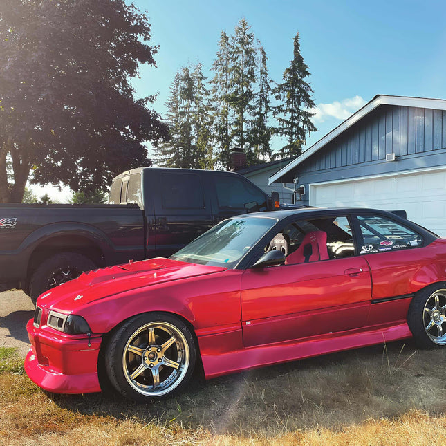 BMW E36 track-spec racing seats with lightweight construction, reinforced side bolsters, and harness compatibility for maximum driver stability.