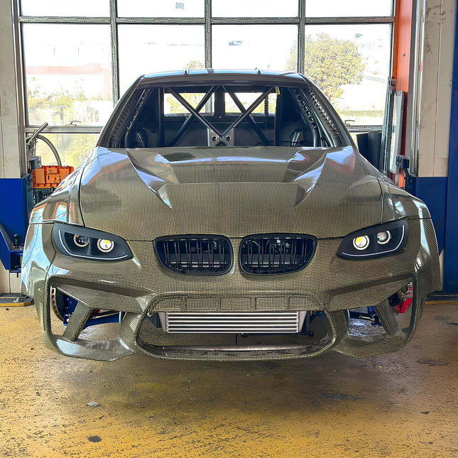 E92 cold air intake system, high-flow air filter, E93 performance air intake, optimized throttle response, 335i cold air intake mod, M3 racing intake kit, track-ready engine airflow upgrade, aggressive induction system, high-performance air delivery.