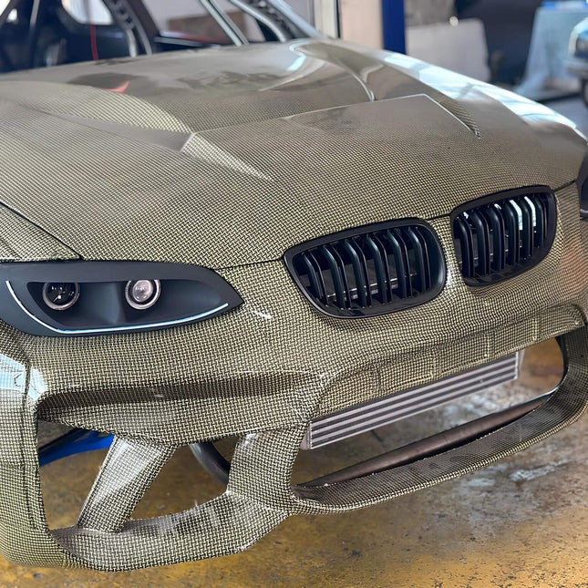 E92 carbon fiber hood, E93 lightweight racing hood, M3-style carbon bonnet, 335i track-ready styling upgrade, aerodynamic weight reduction, aggressive engine bay modification, high-performance exterior mod, custom carbon fiber hood.