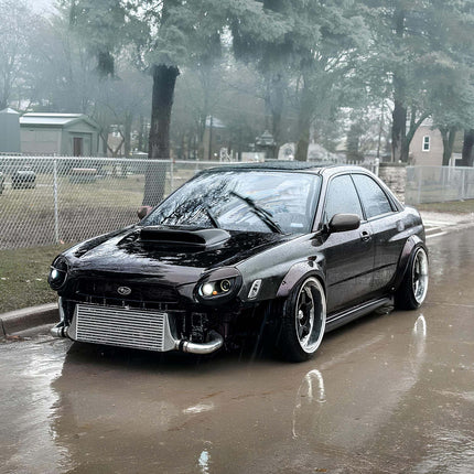 Subaru Impreza WRX fully adjustable coilover suspension, race-spec damping control, improved ride height tuning, track-ready suspension stability, aggressive stance setup.

