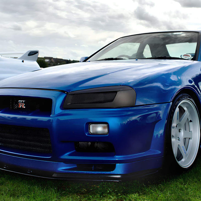 Skyline R34 limited-slip differential (LSD), race-proven torque distribution, reinforced rear end, optimized traction control, high-speed stability.

