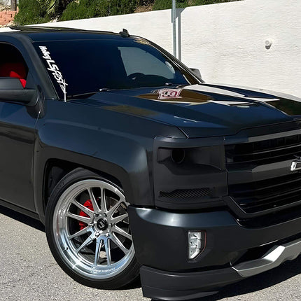 Chevy Silverado fully adjustable lift kit, race-spec suspension dampers, improved off-road stability, aggressive stance setup, high-clearance suspension upgrade.


