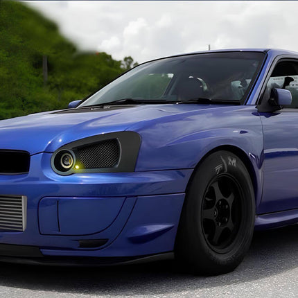 Close-up of the 2005 Subaru Impreza WRX's factory 17-inch alloy wheels, highlighting the multi-spoke design and Subaru center cap, reflecting the model's attention to both performance and style.

