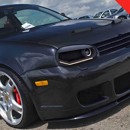 Golf Mk4 headlight vented intake, turbocharged engine air cooling, high-flow intake duct, performance air funnel, drag reduction modification, race-proven airflow optimization, aftermarket lightweight headlamp vent, direct bolt-on fitment.

