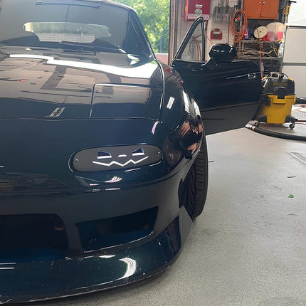 Mazda Miata MX-5 NA Roadster LED headlights, projector retrofit, smoked headlamps, JDM-style black housing, daytime running lights, high-output illumination, enhanced nighttime visibility, HID upgrade.

