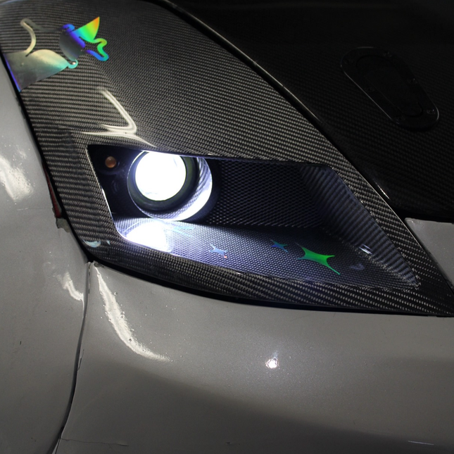 Performance front lip spoiler for Nissan 350Z crafted from high-quality materials to deliver both durability and style. This aerodynamic upgrade increases downforce, improves handling at high speeds, and adds a bold, sporty appearance to the front end of your 350Z.