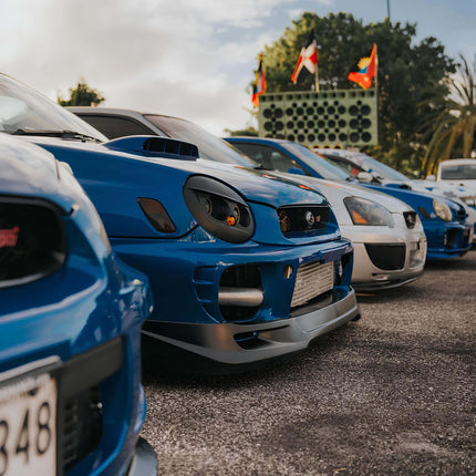 WRX STI big brake kit, lightweight multi-piston calipers, drilled and slotted rotors, high-friction ceramic brake pads, track-ready braking performance.

