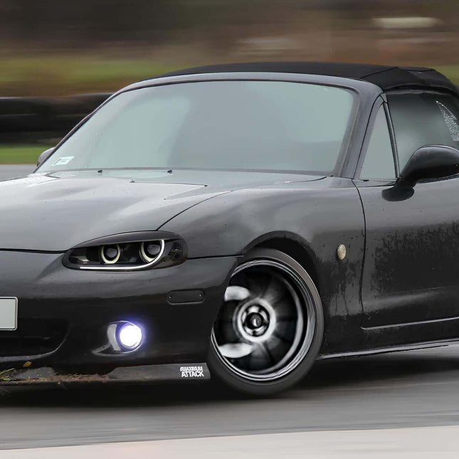 Mazda Miata MX-5 NB1 racing seats, carbon fiber bucket seats, lightweight structure, track-ready bolstered support, suede or leather finish, high-performance interior upgrade, aggressive seating position, JDM cockpit design.

