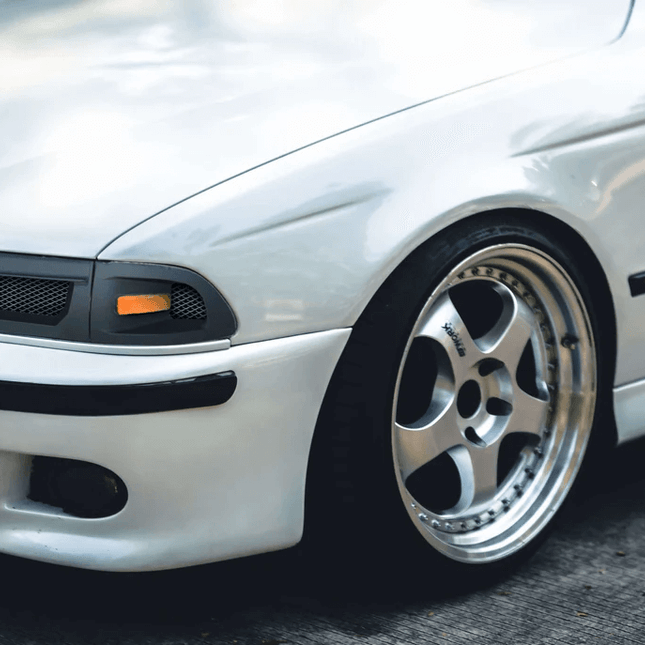 E39 LED projector headlights, Angel Eye headlights, HID conversion, high-performance lighting upgrade, M5 headlight enhancement, adaptive LED headlamp system, aggressive night-driving visibility, track-ready custom headlight modification.

