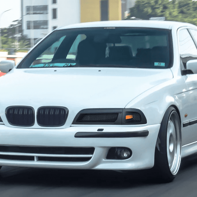 E39 carbon fiber hood, lightweight racing hood, M5-style carbon bonnet, track-ready bodyweight reduction, aerodynamic styling enhancement, high-speed airflow optimization, aggressive front-end styling, race-spec carbon fiber upgrade.

