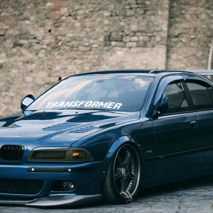 E39 cold air intake, high-flow air filter, performance intake system, optimized throttle response, race-spec induction, M5 air intake upgrade, track-ready airflow enhancement, high-performance air delivery, aggressive engine breathing, custom intake modification.

