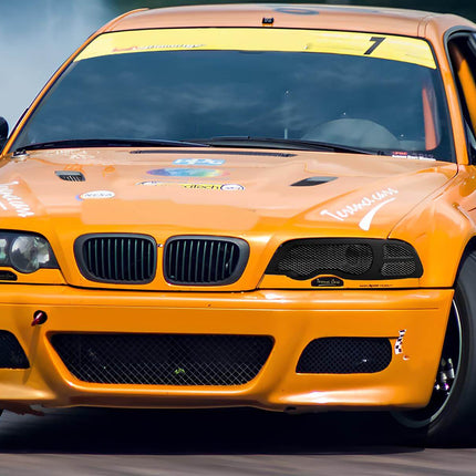 BMW E46 titanium exhaust system, lightweight race-spec exhaust, aggressive performance exhaust note, BMW 330i high-flow cat-back exhaust, 325i custom sound enhancement, track-ready stainless steel exhaust mod, turbocharged exhaust upgrade.