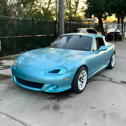 Mazda Miata MX-5 NB1 high-flow fuel pump, upgraded injectors, fuel rail, larger fuel lines, adjustable pressure regulator, race-ready fuel system, optimized air-fuel ratio, forced induction compatibility.

