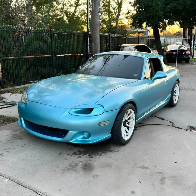 Mazda Miata MX-5 NB1 high-flow fuel pump, upgraded injectors, fuel rail, larger fuel lines, adjustable pressure regulator, race-ready fuel system, optimized air-fuel ratio, forced induction compatibility.

