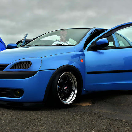 "Side view of a Holden Barina, featuring a five-door layout, aerodynamic body lines, and factory alloy wheels."