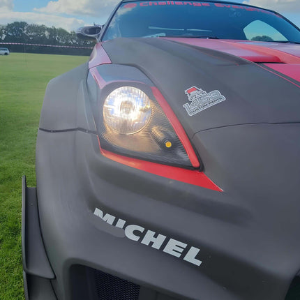 Nissan 350Z underbody aerodynamic paneling, wind tunnel-tested stability enhancement, track-ready high-speed airflow management, aggressive downforce optimization.


