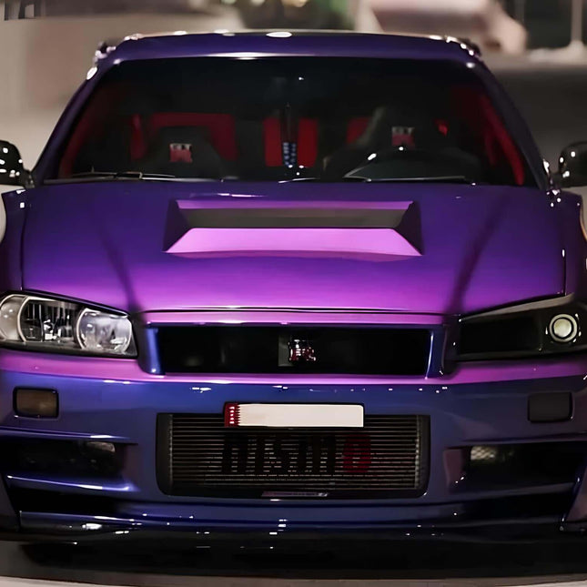 Nissan Skyline R34 forged pistons and lightweight connecting rods, billet crankshaft, high-RPM endurance, increased boost capacity, race-spec engine internals, turbocharged durability, track-ready bottom-end reinforcement.


