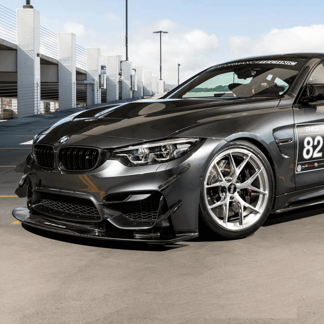 Adjustable coilover suspension for BMW M3 GT4 improves handling, cornering grip, and track stability.
