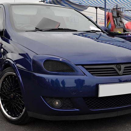 "Rear view of a Vauxhall Corsa, highlighting its distinctive taillights, hatchback design, and subtle roof spoiler."