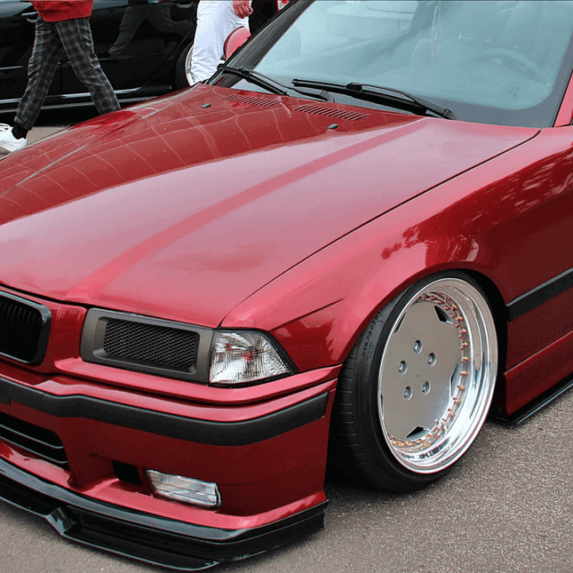 Carbon fiber hood for BMW E36 Coupe and Sedan with lightweight construction for improved aerodynamics, better power-to-weight ratio, and race-inspired styling. Direct bolt-on replacement for factory steel hoods.