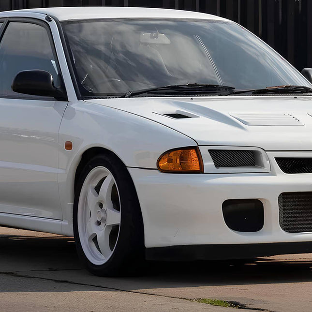 Mitsubishi Evolution I, II, III carbon fiber hood, vented lightweight racing design, improved engine cooling, high-performance weight reduction, aggressive styling, track-proven aerodynamics, JDM-spec heat dissipation upgrade, street-legal carbon bonnet.

