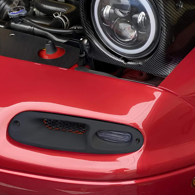 Mazda Miata MX-5 NA Roadster front turn signal assembly, OEM-style bumper indicators, clear lens signal lights, high-power LED flashers, improved road safety, track-legal front bumper lighting.

