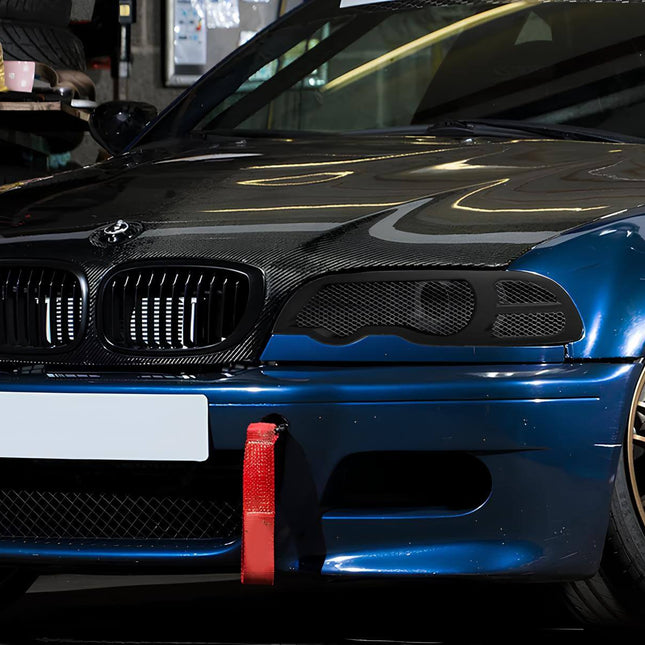 BMW E46 front lip splitter, carbon fiber aerodynamic upgrade, M3-style front bumper lip, 330i track-ready front-end styling, BMW 325i aggressive front splitter, downforce improvement, lightweight carbon fiber mod, performance aero styling.