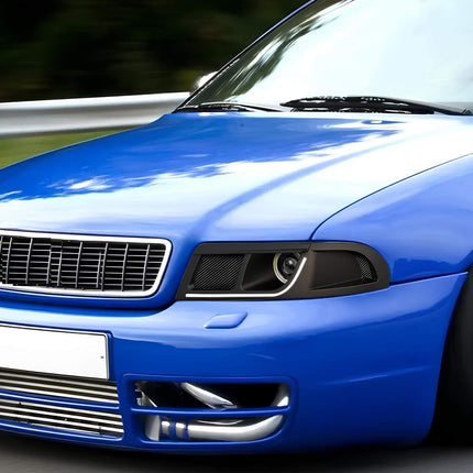 Modernize your Audi A4 B5 S4 (1997-2001) headlight with this custom upgrade kit that includes a matte black finish, LED white/yellow signals, simple bracket mounting, durable protective mesh, and an air channel ending with a turbo-ready connector for optimal performance.
