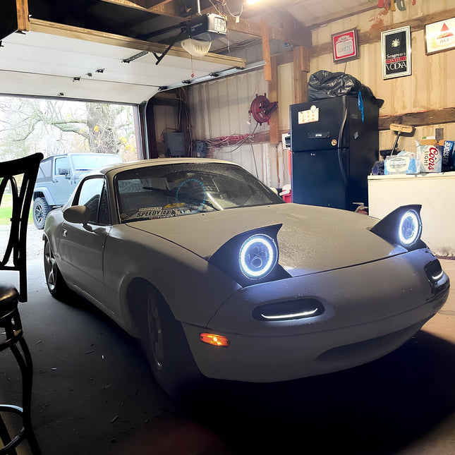 Mazda Miata MX-5 NA Roadster custom LED turn signals, smoked or clear bumper-mounted indicator lights, high-intensity sequential amber flashers, stylish road safety enhancement, modern visibility upgrade.

