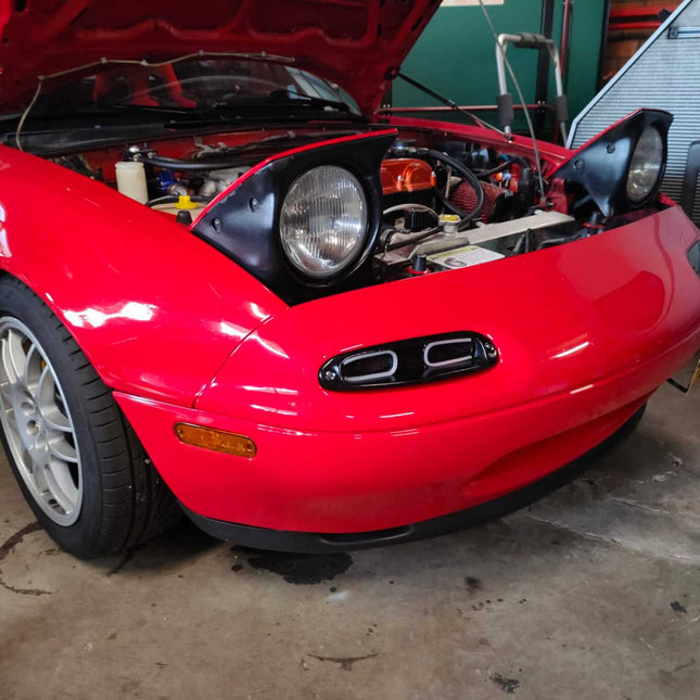 Coilover suspension for MX-5 Miata NA improves handling, ride comfort, and adjustability for a sportier feel.