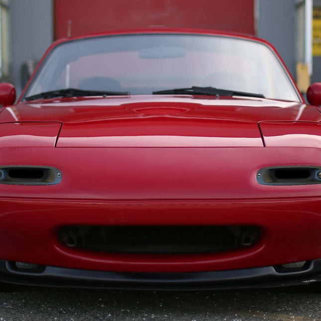Mazda Miata MX-5 NA Roadster LED pop-up headlight conversion, projector retrofit, high-output HID bulbs, modern front-end styling, improved night visibility, plug-and-play installation, JDM upgrade.

