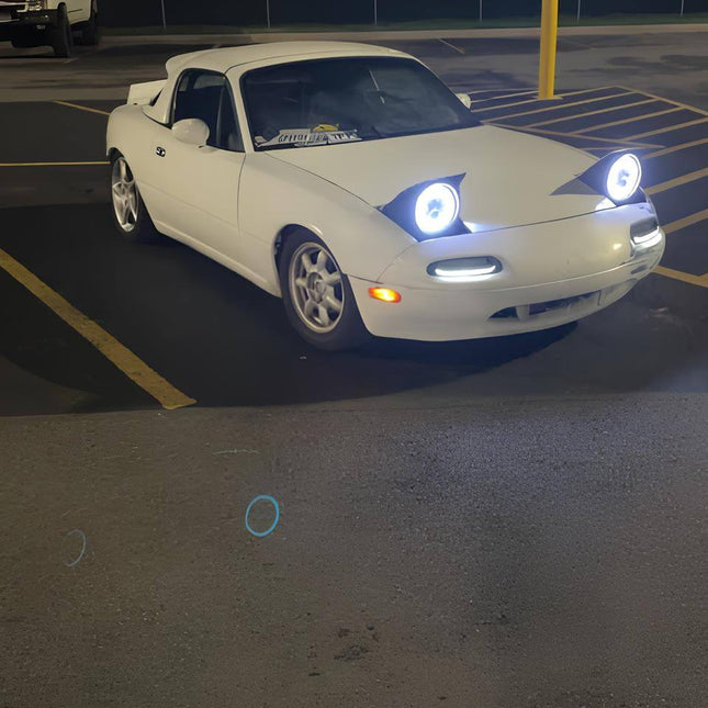 Miata MX-5 NA Roadster crystal-clear LED bumper turn signals, sequential amber flashers, JDM-inspired styling, track-ready plug-and-play installation, high-performance front-end lighting enhancement.

