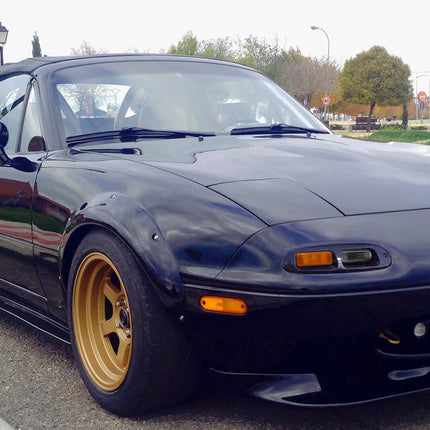 Mazda Miata MX-5 NA Roadster upgraded bumper-mounted turn signals, LED amber flashers, aggressive front-end aesthetic, track-inspired lighting solution, modern visibility upgrade, plug-and-play fitment.

