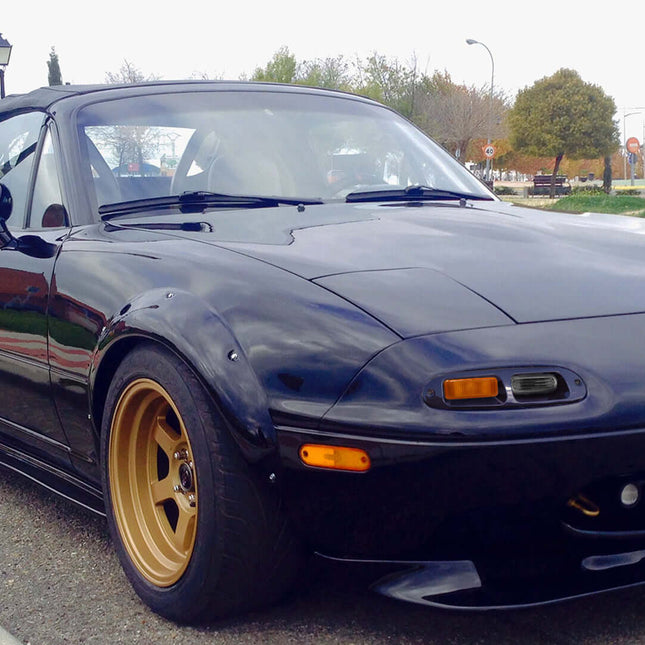 Mazda Miata MX-5 NA Roadster upgraded bumper-mounted turn signals, LED amber flashers, aggressive front-end aesthetic, track-inspired lighting solution, modern visibility upgrade, plug-and-play fitment.

