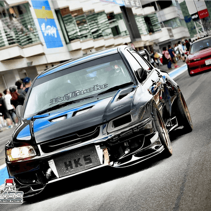 Mitsubishi Evo 7, 8, 9 carbon fiber intake system, high-flow cold air intake, short ram intake, velocity stack, improved throttle response, increased airflow, race-ready induction upgrade, JDM-spec power enhancement.


