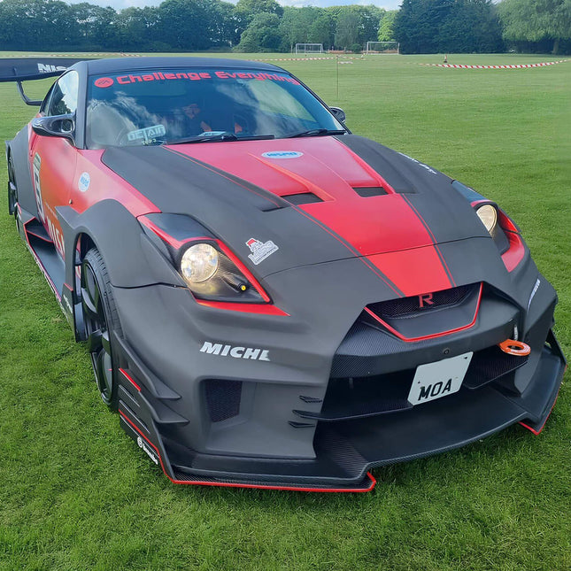 Nissan 350Z high-flow mass air sensor, optimized engine tuning, improved throttle response, increased airflow measurement accuracy, race-ready induction system upgrade.

