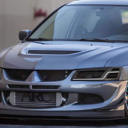 Mitsubishi Evolution 7, 8, 9 big brake kit, slotted rotors, ceramic brake pads, stainless steel brake lines, upgraded calipers, race-spec stopping power, track-ready braking system.

