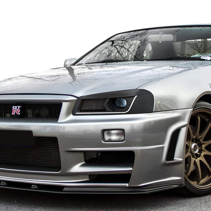 Skyline R34 GTR reinforced sway bar end links, upgraded suspension geometry, race-proven cornering stability, high-performance chassis rigidity, optimized track handling.

