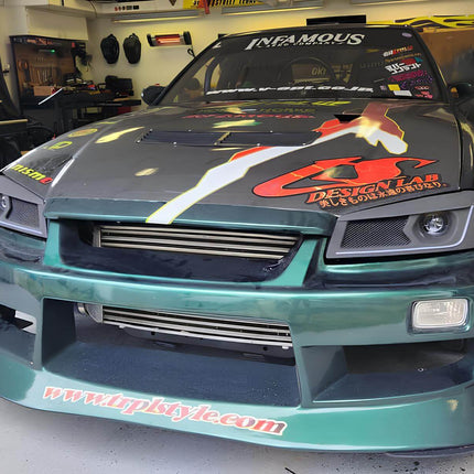 Skyline R34 racing harness kit, FIA-approved 5-point seatbelt system, reinforced seat anchor points, high-speed driver safety enhancement, aggressive track compliance.

