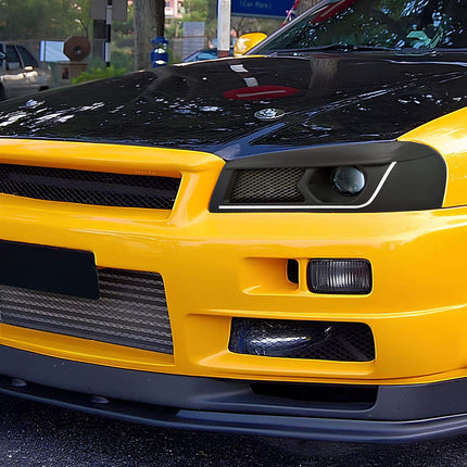 Nissan Skyline R34 polyurethane control arm bushings, high-strength suspension upgrade, improved steering feedback, aggressive cornering response, track-spec handling modification.


