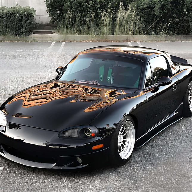 Mazda Miata MX-5 NB2 adjustable coilovers, full damping control, track-tuned suspension, camber kit, sway bars, polyurethane bushings, race-proven handling, aggressive stance, precision suspension tuning.

